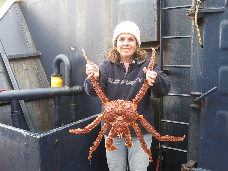 Dr. Norman holding a king crab